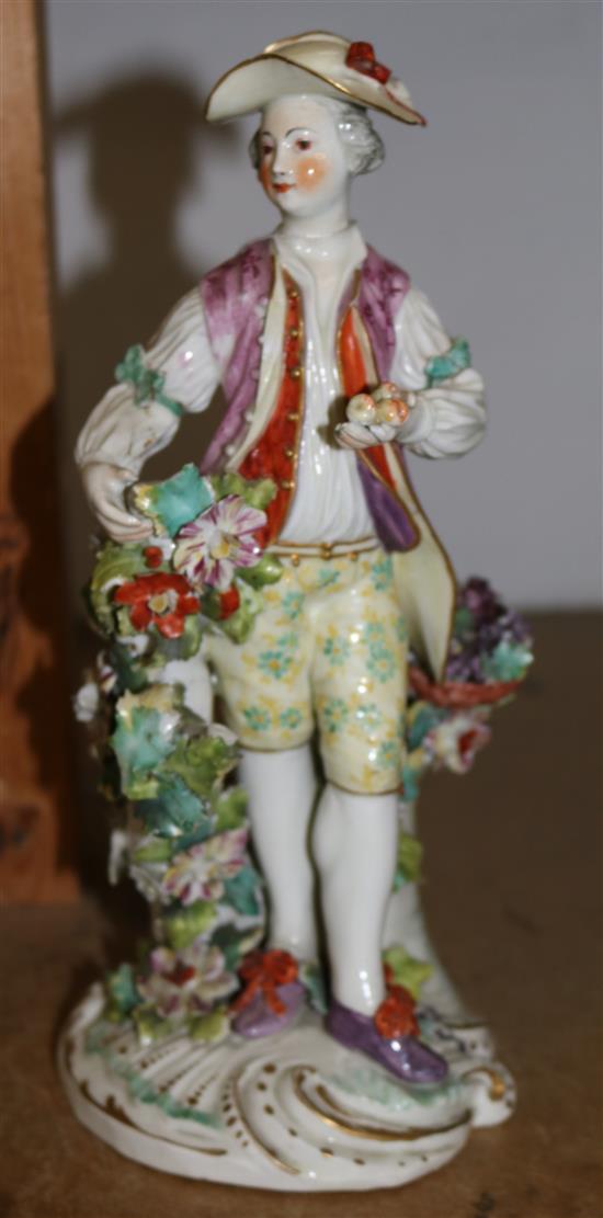 Derby figure of a fruit seller or gardener, c.1765, height 26cm, firing cracks and losses(-)